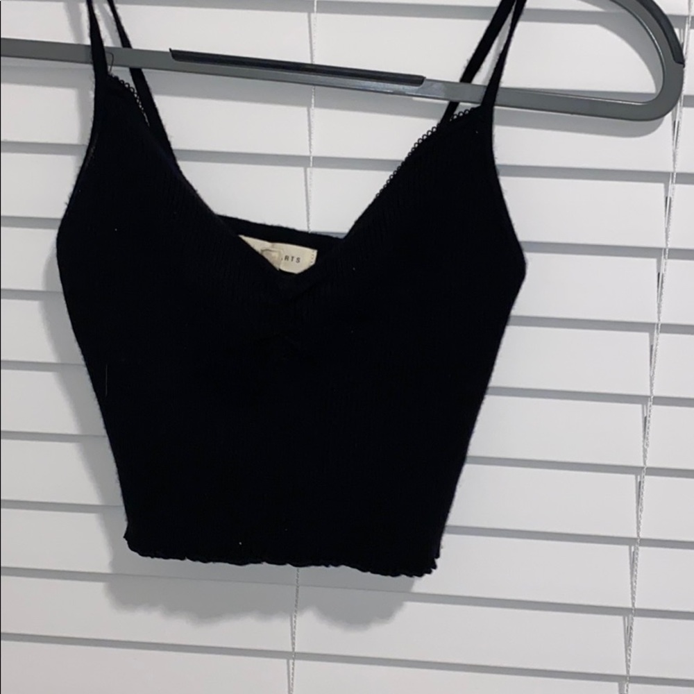 black tank top with rouching and a  frilled bottom